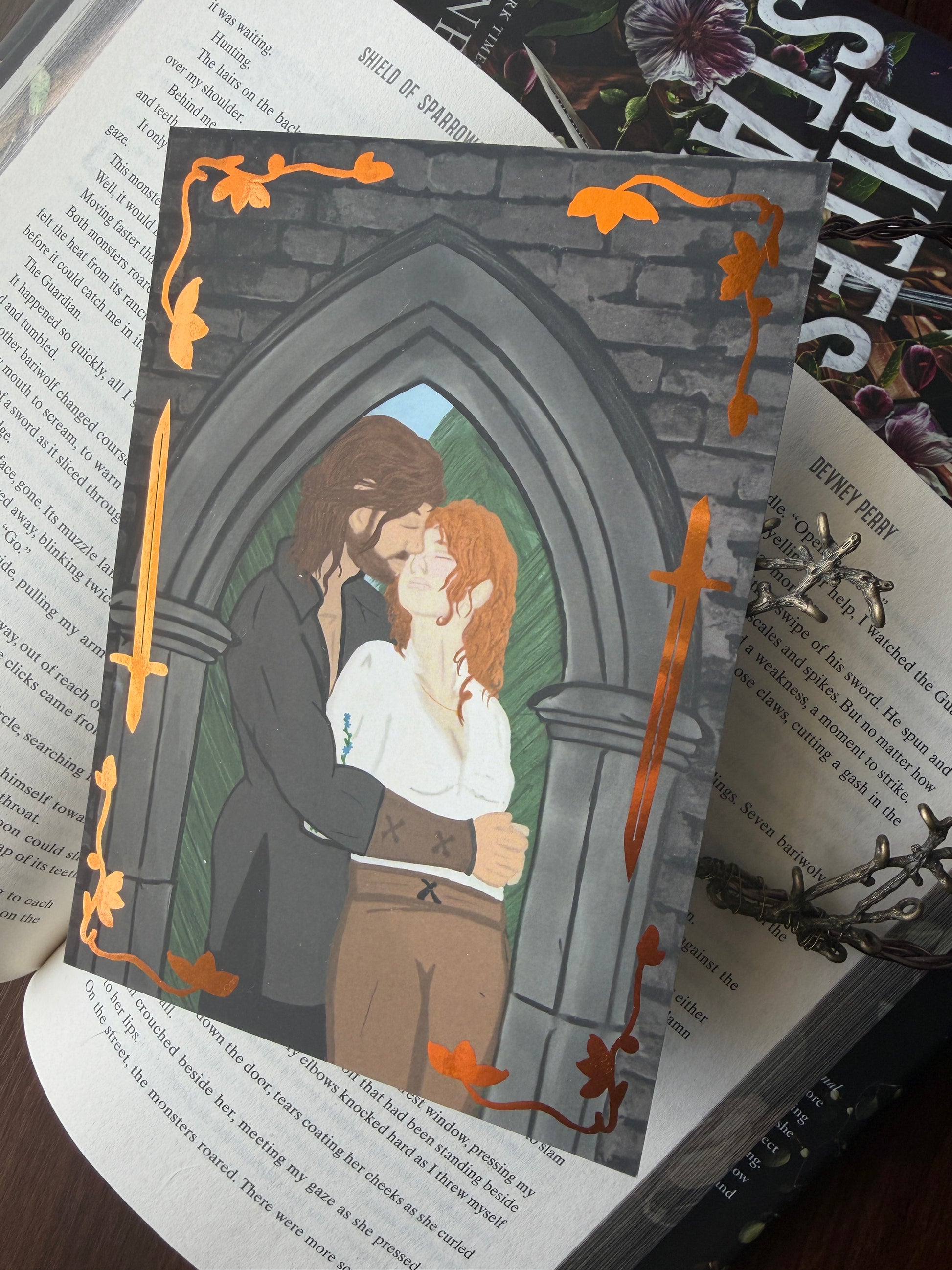 Illustration of a couple embracing in a window on top of a book